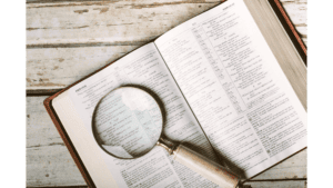 [img] bible under a magnifying glass